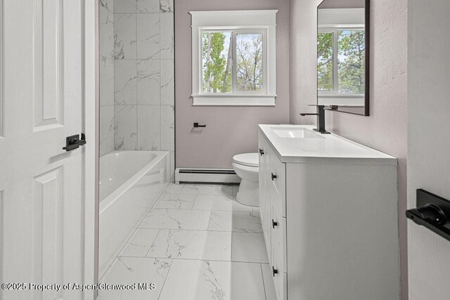 885 Stout St, Craig, CO 81625 - bathroom with a baseboard radiator, marble look tile flooring, vanity, and healthy amount of natural light