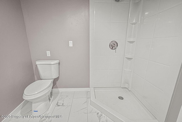 885 Stout St, Craig, CO 81625 - full bath with marble finish floors, baseboards, toilet, and a stall shower
