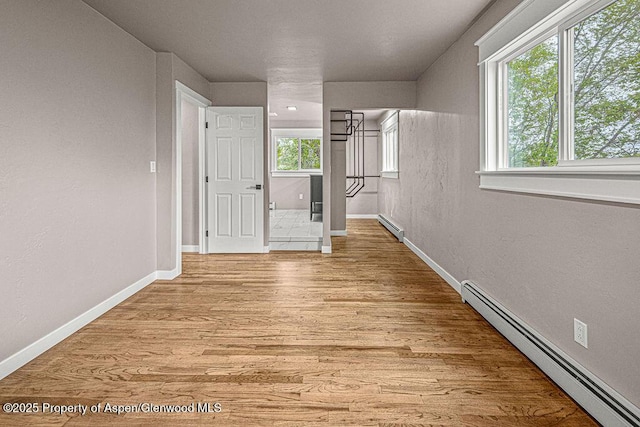 885 Stout St, Craig, CO 81625 - spare room with baseboard heating, a baseboard heating unit, light wood finished floors, and baseboards