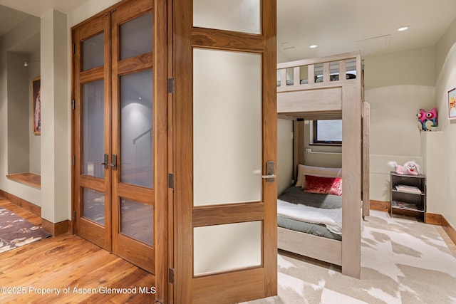 interior space featuring french doors and light wood-type flooring