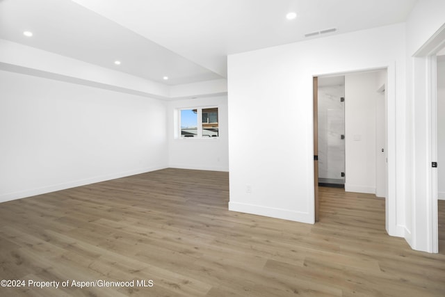 spare room with wood-type flooring