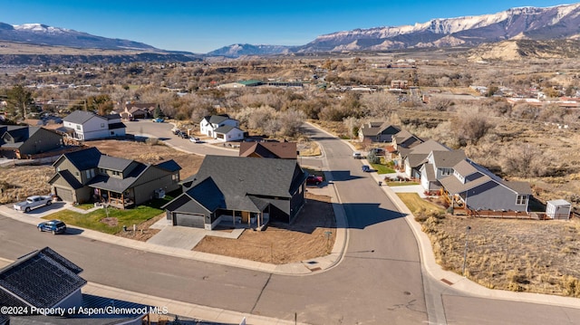 birds eye view of property with a mountain view