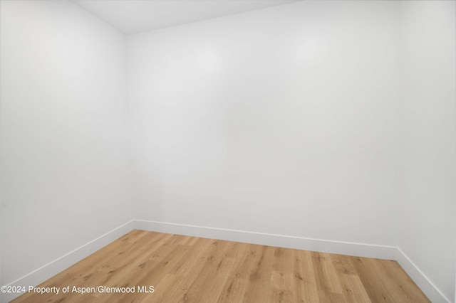 spare room with hardwood / wood-style floors