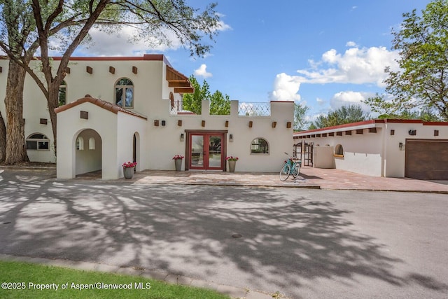 2459 Emma Rd, Basalt, CO 81621 - view of front of house with french doors and stucco siding