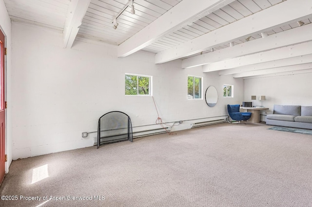 2459 Emma Rd, Basalt, CO 81621 - carpeted living area with beam ceiling and a baseboard radiator