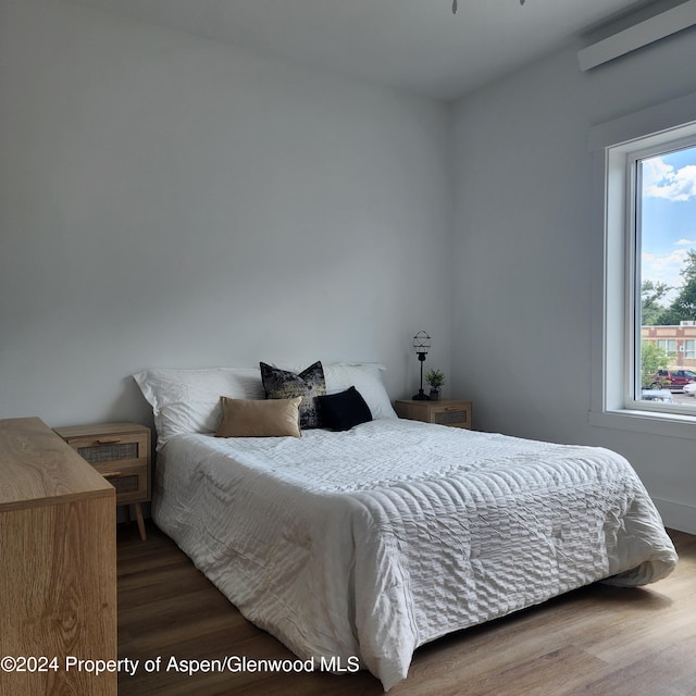 bedroom featuring hardwood / wood-style floors