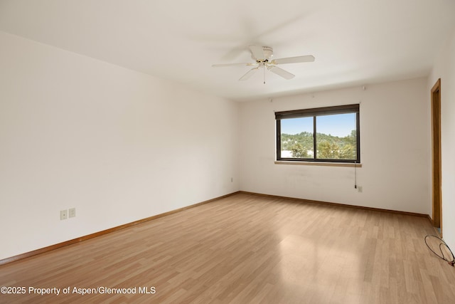 unfurnished room featuring ceiling fan and light hardwood / wood-style floors