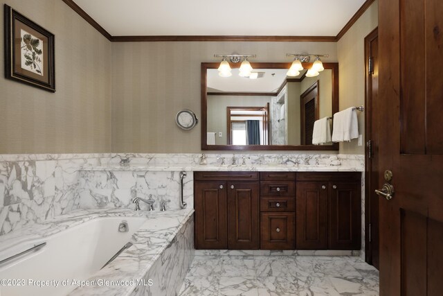 bathroom with vanity, ornamental molding, and tiled tub