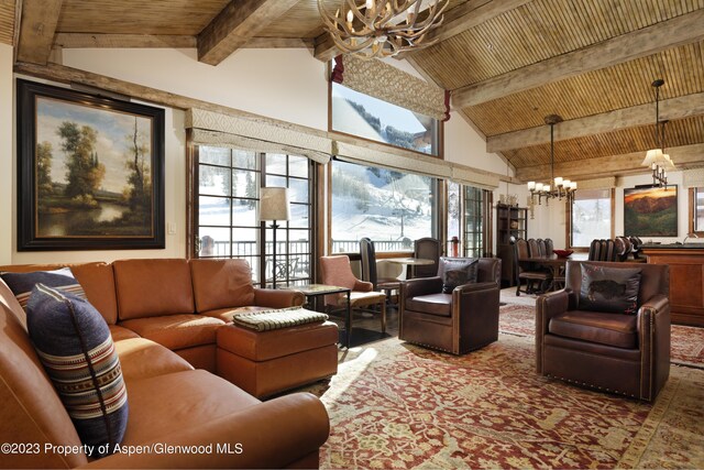 interior space featuring beam ceiling, an inviting chandelier, and wood ceiling