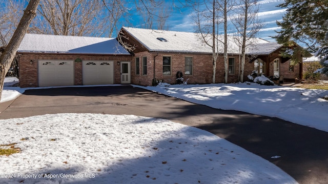 single story home with a garage