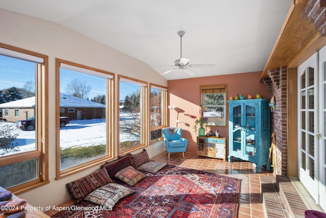 sunroom / solarium featuring ceiling fan and lofted ceiling