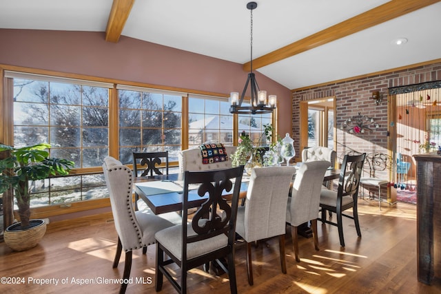 dining space with a chandelier, vaulted ceiling with beams, and hardwood / wood-style flooring