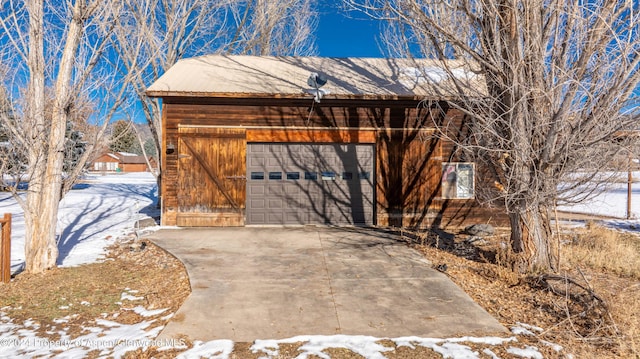 exterior space featuring an outbuilding and a garage