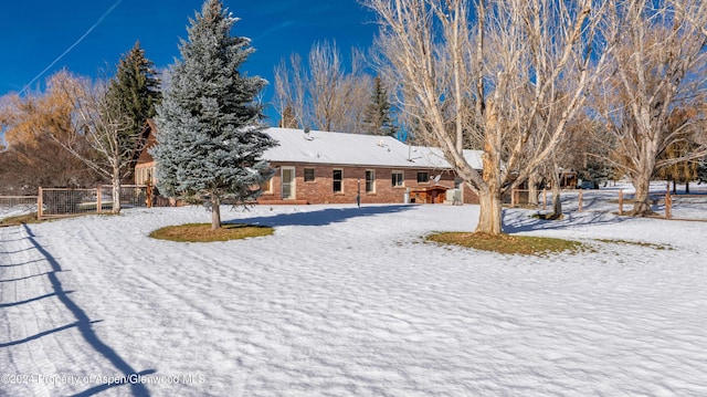 view of yard covered in snow