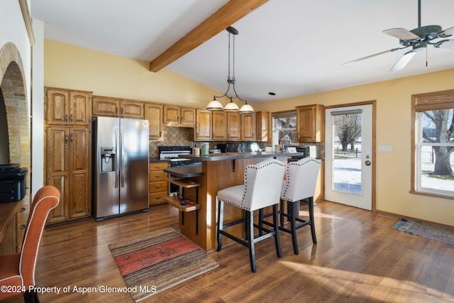 kitchen featuring stainless steel refrigerator with ice dispenser, dark hardwood / wood-style flooring, tasteful backsplash, and hanging light fixtures