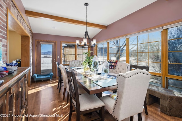 dining room with vaulted ceiling with beams, a notable chandelier, and dark hardwood / wood-style flooring