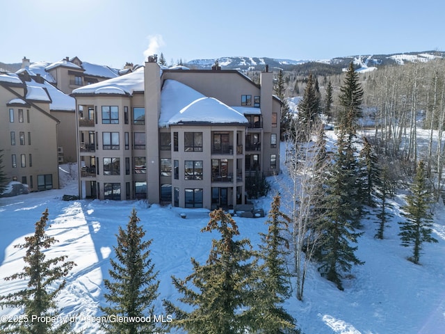 view of snow covered property