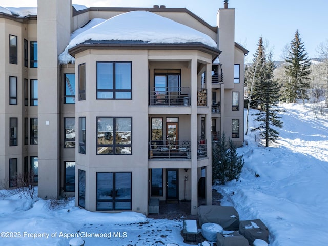 view of snow covered property