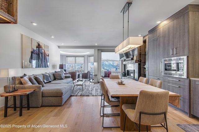 dining area featuring light wood-type flooring