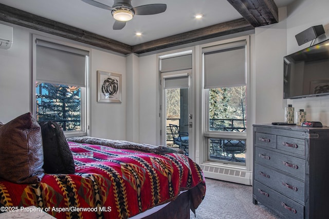 carpeted bedroom featuring ceiling fan, access to exterior, and an AC wall unit