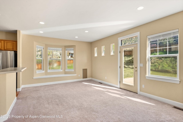 440 Stage Coach Ln, New Castle, CO 81647 - unfurnished living room with light carpet, baseboards, and recessed lighting