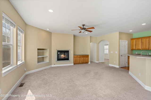 440 Stage Coach Ln, New Castle, CO 81647 - unfurnished living room with baseboards, visible vents, and light colored carpet