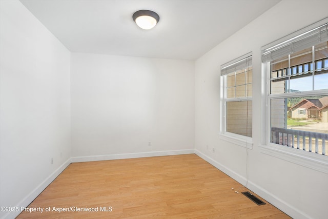 440 Stage Coach Ln, New Castle, CO 81647 - spare room featuring baseboards, light wood finished floors, and visible vents