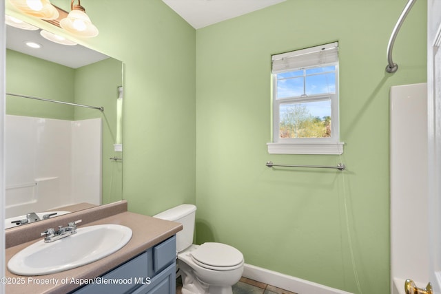 440 Stage Coach Ln, New Castle, CO 81647 - bathroom with toilet, baseboards, tile patterned floors, vanity, and a shower