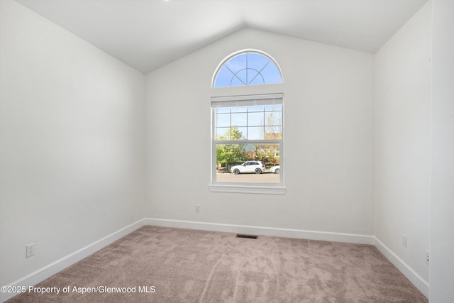440 Stage Coach Ln, New Castle, CO 81647 - unfurnished room with vaulted ceiling, carpet, visible vents, and baseboards