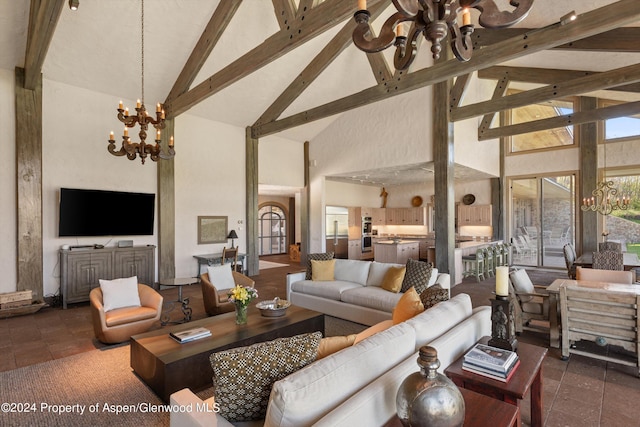 tiled living room with beamed ceiling, high vaulted ceiling, and a chandelier