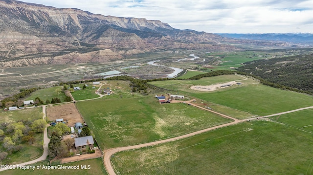 birds eye view of property featuring a rural view and a mountain view
