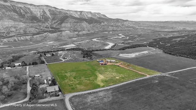 birds eye view of property with a mountain view