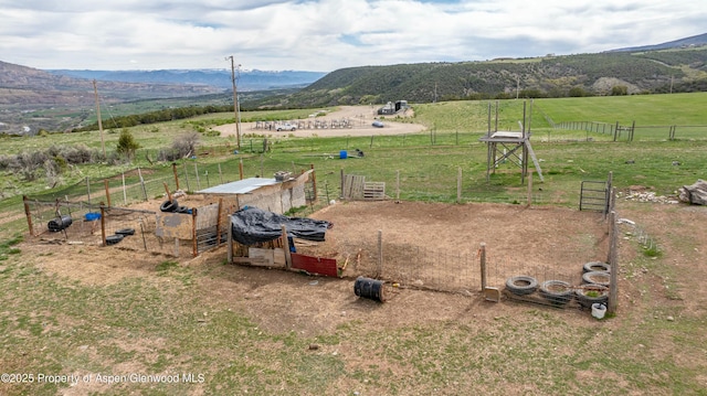 exterior space with a rural view and a mountain view