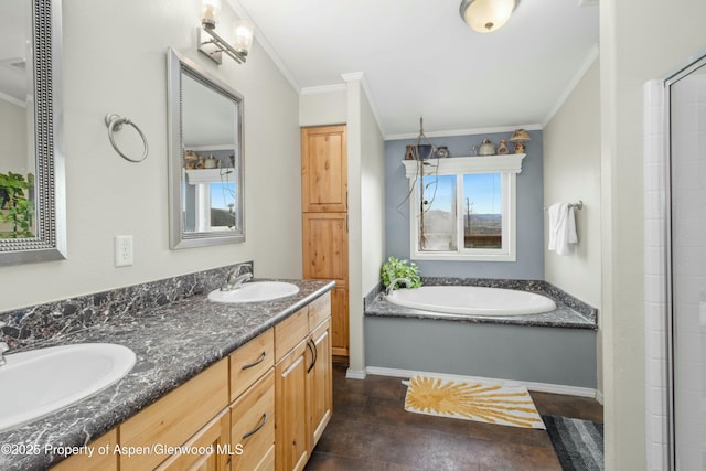 bathroom featuring crown molding, a garden tub, a sink, and double vanity