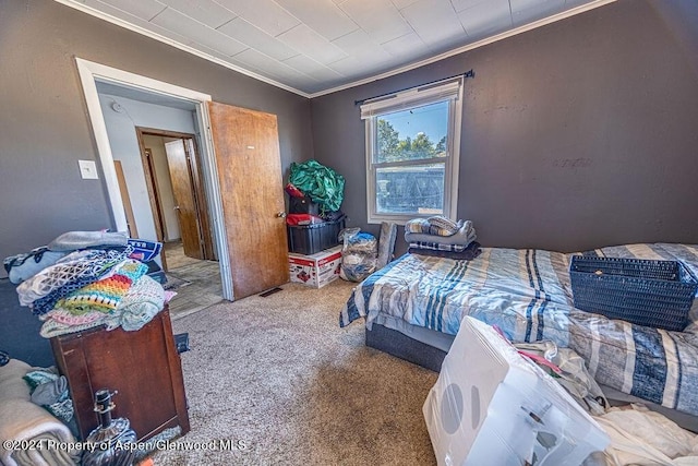 carpeted bedroom with crown molding