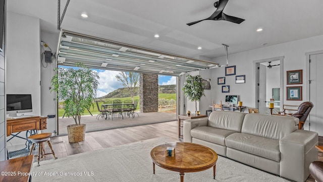 63 Meadow Creek Ct, Battlement Mesa, CO 81635 - living area featuring ceiling fan, a wall of windows, wood finished floors, and recessed lighting