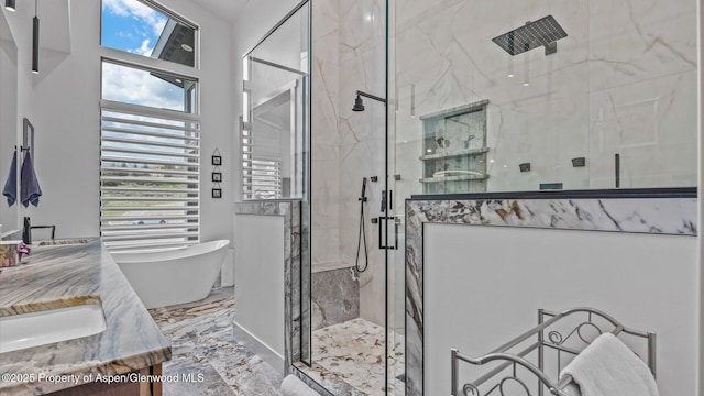 63 Meadow Creek Ct, Battlement Mesa, CO 81635 - bathroom featuring a freestanding tub, marble finish floor, vanity, and a marble finish shower