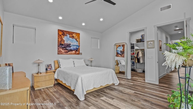 63 Meadow Creek Ct, Battlement Mesa, CO 81635 - bedroom with vaulted ceiling, visible vents, a spacious closet, recessed lighting, and wood finished floors