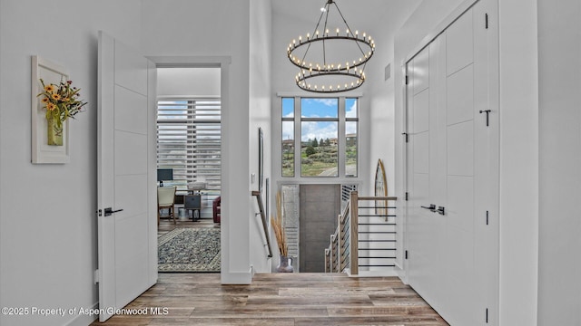 63 Meadow Creek Ct, Battlement Mesa, CO 81635 - interior space featuring a notable chandelier and wood finished floors