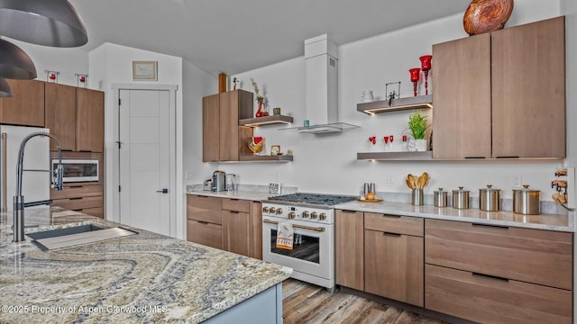 63 Meadow Creek Ct, Battlement Mesa, CO 81635 - kitchen with open shelves, wall chimney range hood, a sink, light wood-style floors, and high end range