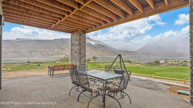 63 Meadow Creek Ct, Battlement Mesa, CO 81635 - view of patio with a mountain view and outdoor dining space