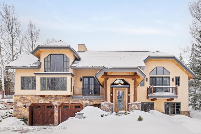 view of front of house with a balcony and a garage