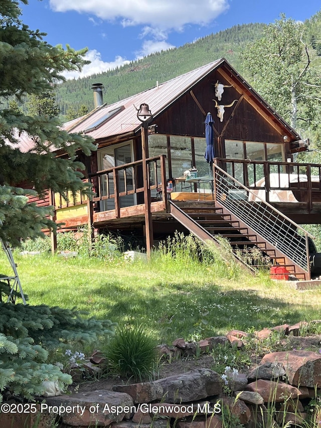 15405 Frying Pan Rd, Basalt, CO 81621 - view of front of property with a view of trees, a metal roof, and stairway