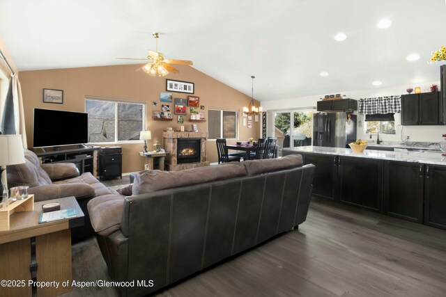 31 Hawthorne Way, Parachute, CO 81635 - living area with recessed lighting, lofted ceiling, wood finished floors, and ceiling fan with notable chandelier