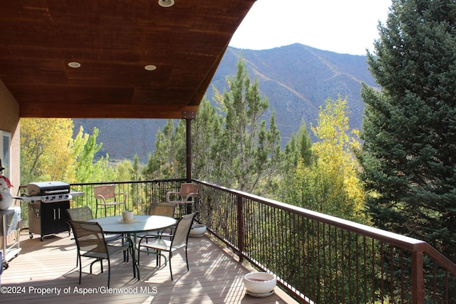 exterior space featuring a mountain view and area for grilling