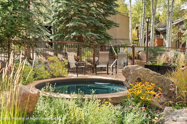 view of pool featuring a patio area and fence