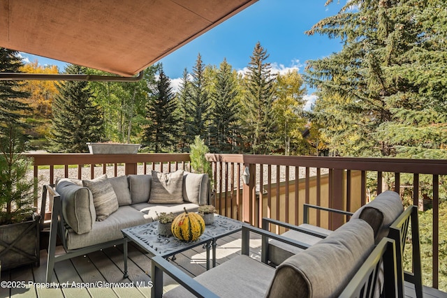 wooden deck with an outdoor hangout area