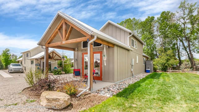 329 River Frontage Rd # 14, Silt, CO 81652 - rear view of house with board and batten siding and a yard