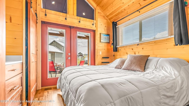 329 River Frontage Rd # 14, Silt, CO 81652 - bedroom with access to outside, wood finished floors, lofted ceiling, wooden walls, and wood ceiling