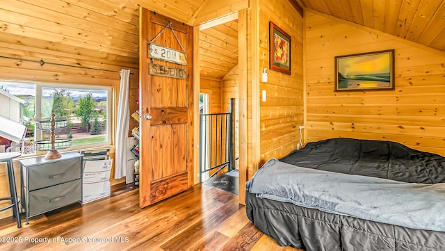 329 River Frontage Rd # 14, Silt, CO 81652 - bedroom featuring lofted ceiling, wooden walls, wooden ceiling, and wood finished floors